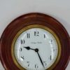 Vintage industrial electric clock in wood and metal
