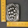 Bunch of grapes carved in steel