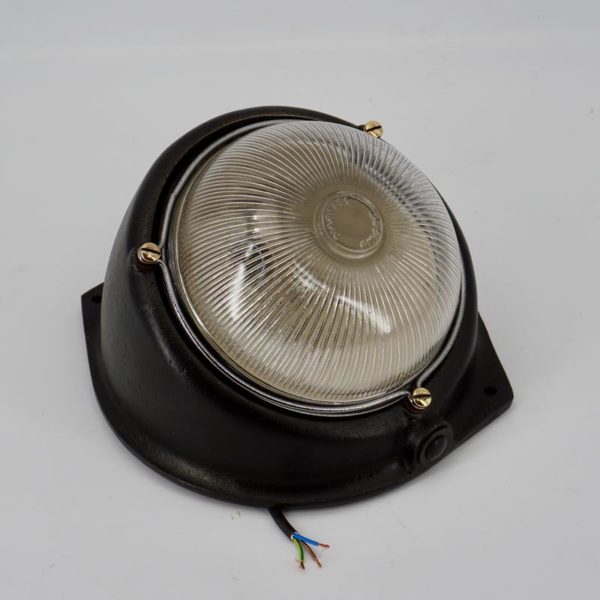 Old industrial wall light with ribbed glass