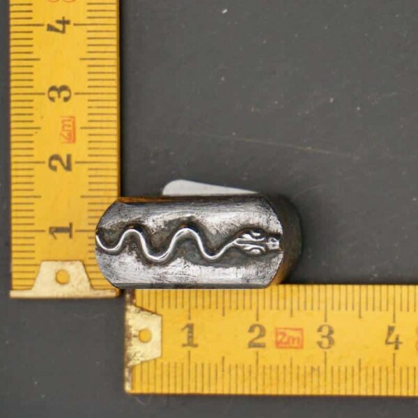 Small engraved steel snake