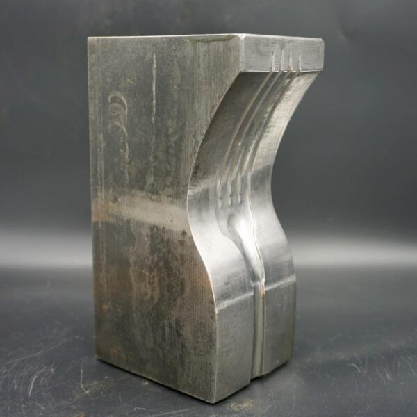 Large steel bookend with engraved fork