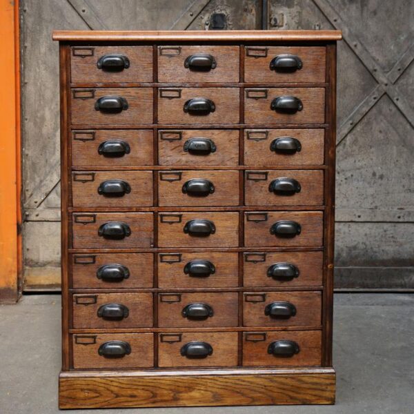 Wooden storage unit with drawers and label holder
