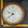 Small industrial electric clock in wood and brass