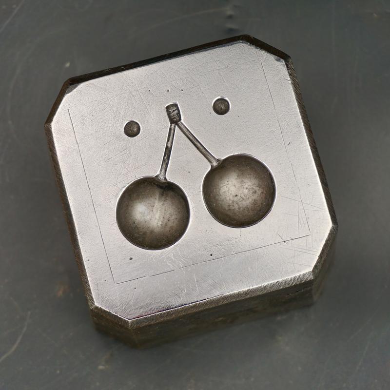 Steel paperweight