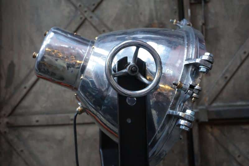 Vintage industrial factory spotlight with adjustment wheel.