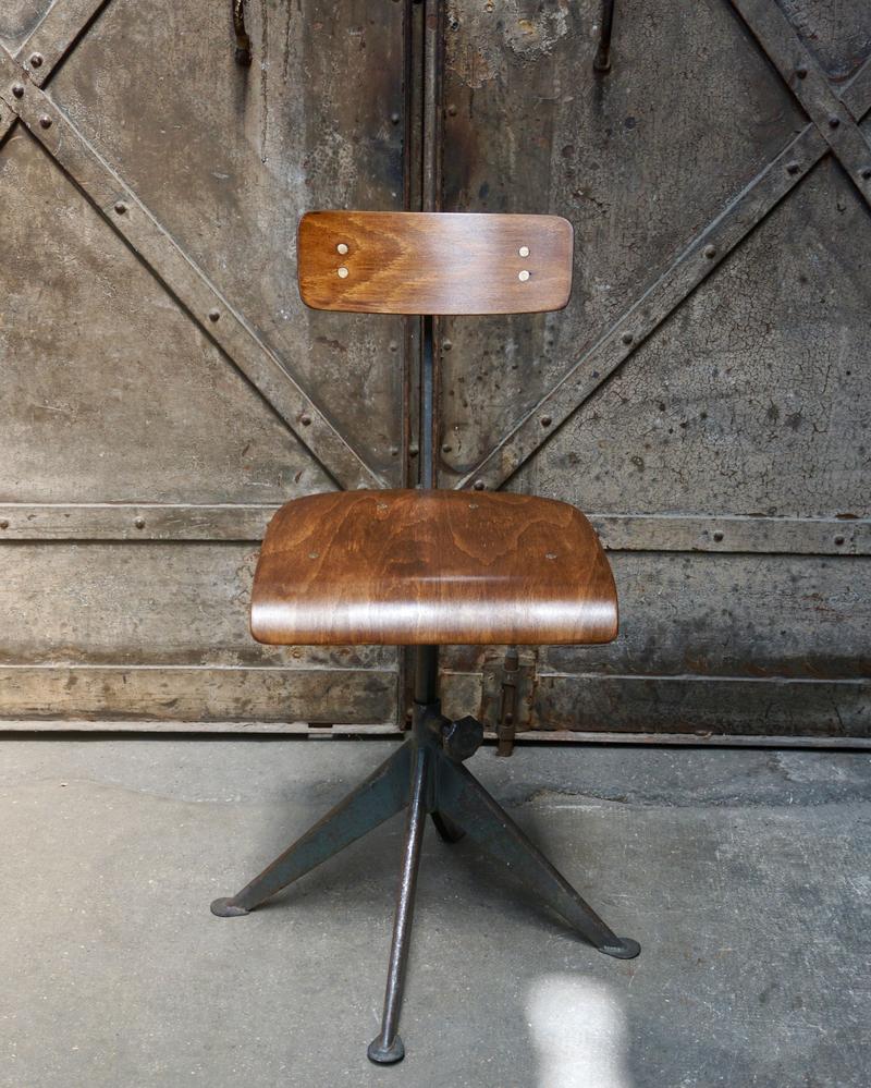 Antique chair with metal frame and wooden seat
